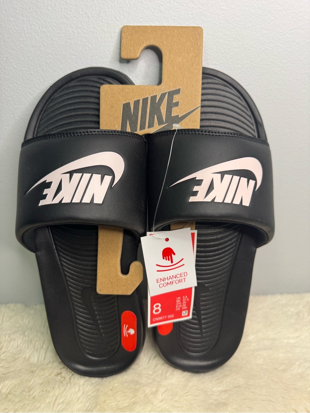 Nike Women’s Black Slide Sandals with Pink Logo